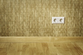 Double Socket In The Wall Of An Empty Room