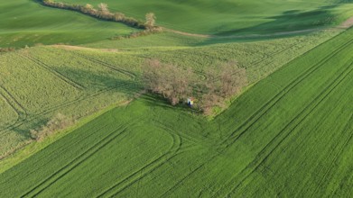 Aerial view of Chapel st. Barbara on South Moravian hill fields during spring time, Moravia, Czech