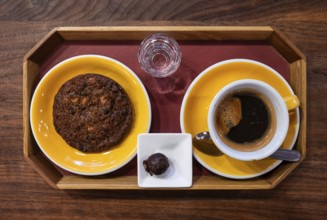 Plate with American style chocolate cookie, a coffee and a luxury chocolate, Brussels, Belgium