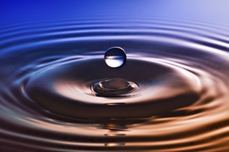 Another drop of water on a blue bronze background
