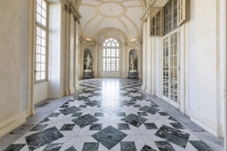 Venaria Reale, Italy, January 2023: luxury interior old royal palace. Gallery perspective with