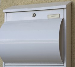 Modern white metal post box, Austria