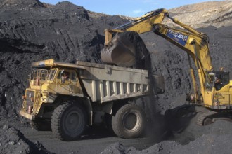 WESTPORT, NEW ZEALAND, CIRCA 2007: Digger loads up a truck with high grade coal at Stockton Coal
