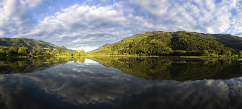 Clouds are reflected in the lake, Gaishorner See in the evening light, panoramic picture, Gaishorn