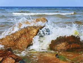 Waves Breaking On Rocks At The Sea Shore