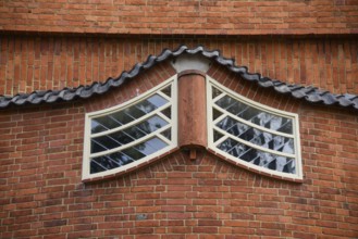 Amsterdam, Netherlands. June 2022. View of the facades of the characteristic brick building of