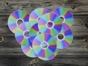 Cd disks over the wooden background