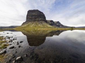 Rock massif Lomagnupur or Lómagnúpur, reflection in a pond, South Iceland, Iceland