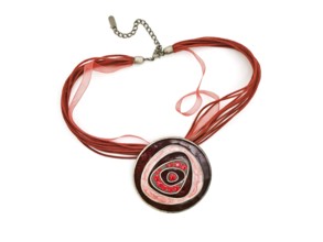 Fashion necklace with bright red gems over white background
