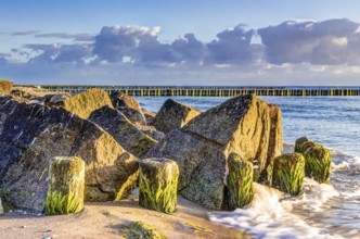Wooden and rocky groynes on the coastline of the Baltic Sea, Germany