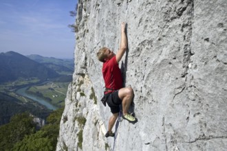 A man climbs a rock face, Lossenstein, 35, years