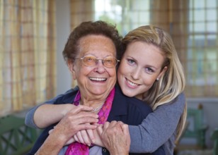 A grandson visits his grandmother Fun and joy during the hug. Austria