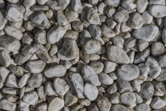 Gravel quarry - round rock and river gravel as background, bird's eye view