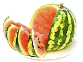 Watermelon With Slices At Plate Against The White Background Daugavpils, Latvia