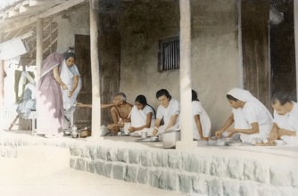 Mahatma Gandhi and others taking dinner Sevagram Ashram, Wardha, India, Asia, November 1933