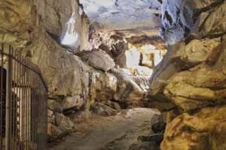 A stalactite cave with a path in the middle