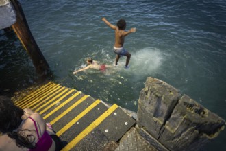 Children jumping into the sea, Cobh, Harbor of Cork, County Cork, Ireland, United Kingdom