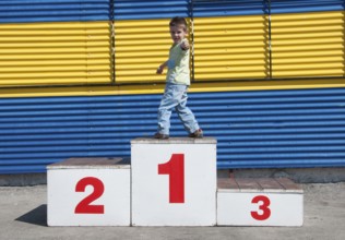 Little boy on the podium. First place