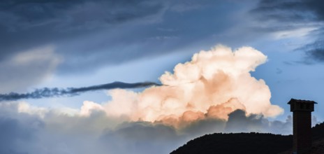 Dramatic clouds and deep blue sky. Sunset
