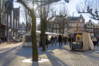 Tourists visiting the fair at Spui Square