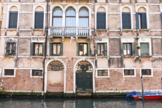 Facade of a palazzo on a canal, Venice, Italy