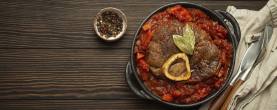 Traditional Italian dish Ossobuco all Milanese made with cut veal shank meat with vegetable tomato