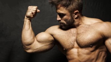 An image of a muscular man flexing his biceps
