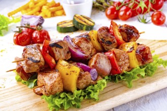 Tasty and colorful meat skewers with peppers and onions