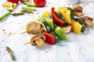 Vegetarian skewers white mushrooms, peppers and zucchini for barbecue