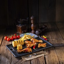 Rustic Grilled chicken wings, legs, and spicy corn