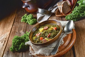 Rustic kale soup with meat and sausage