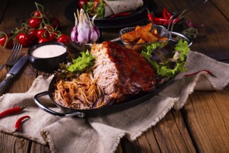 Delicious pulled pork with jacket potato quarters