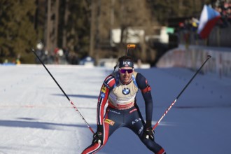 Sturla Holm Laegreid (Norway/NOR) crossing the finish line in the sprint at the IBU Biathlon World