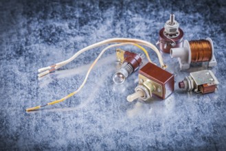Group of electric devices on metallic background vintage electricity concept