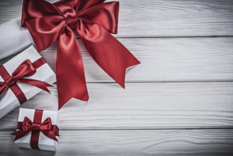 Paper roll with red bow giftboxes holidays concept