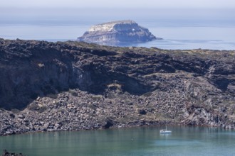 Volcanic island Palea Kameni, behind Aspronisi, white island, uninhabited island, part of the