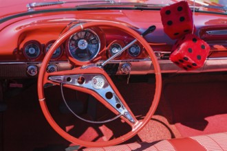 Red car interior with red dice