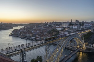 Illuminated Porto City, Douro River and Dom Luis bridge I with Tram. View from Tourist Viewpoint