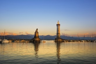 Harbour entrance of Lindau with lighthouse and sculpture of lion Lindau, Germany