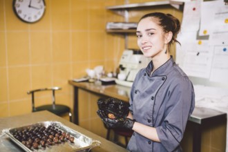 Subject profession and cooking pastry. young Caucasian woman with tattoo of pastry chef in kitchen