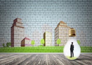 Businessman inside light bulb against city drawn concept