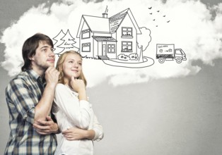 Loving young couple hugging each other and dreaming