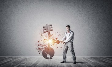 Determined businessman in empty interior breaking with violin stone key figure