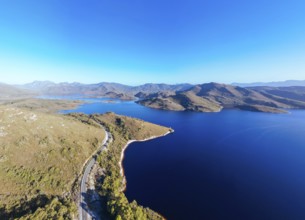 Aerial landscape of Lake Pedder on a hot summer's afternoon in Southwest National Park, Tasmania,