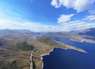 Aerial landscape of Lake Plimsoll on a hot summer's afternoon in Tasmania, Australia