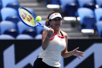 MELBOURNE, AUSTRALIA - JANUARY 10: Iva Majoli of Croatia partners Mansour Bahrami of France in the
