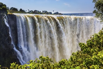 Journey after the wet season. Grand and deep Victoria Falls after the rainy season. Victoria