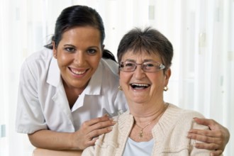 A carer caring for the elderly in a retirement home in Austria