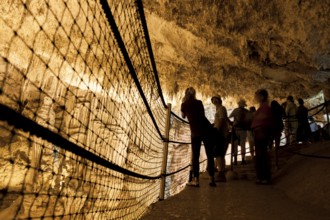 Tourists admire the incredible cave of Neptune. Alghero, Sardinia. Italy