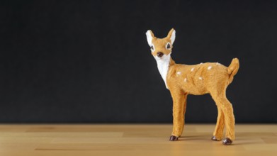 An image of a Christmas decoration deer on black background